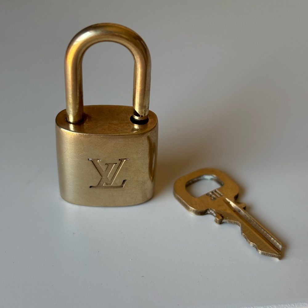Louis Vuitton Gold Padlock & Key #311 on House of Harlow multi layer necklace